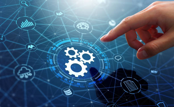 Business hand selecting gears on a connected technology network